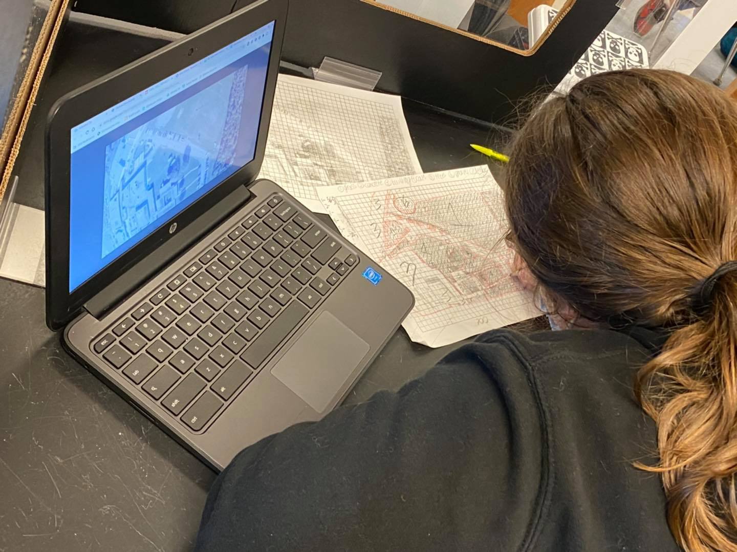 Student working on coloring a topographical map