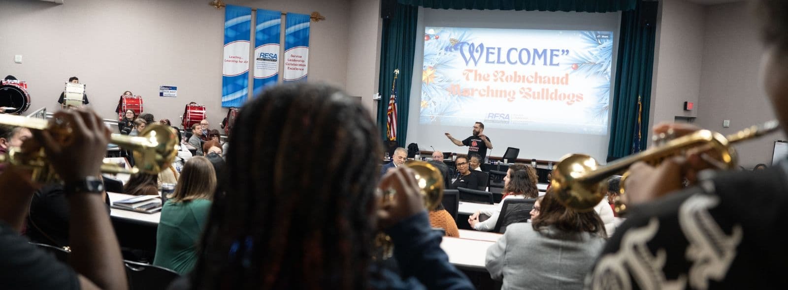 Special Board Meeting with Robichaud Marching Band with active participants playing instruments